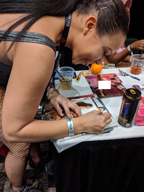 Adriana Maya signing photos