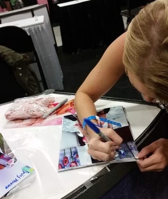 Daisey Monroe signing photos